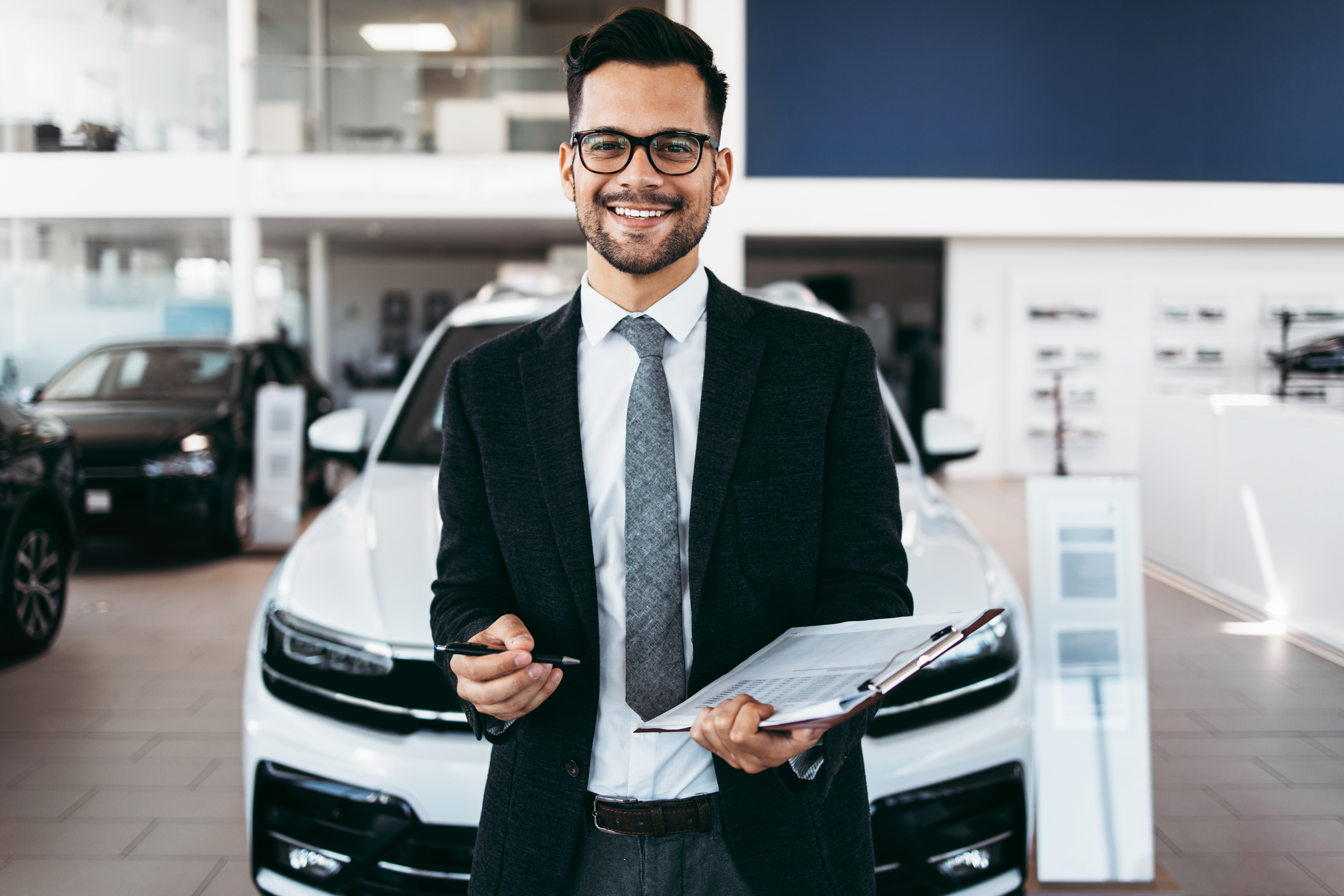 Confident auto sales man that has insurance