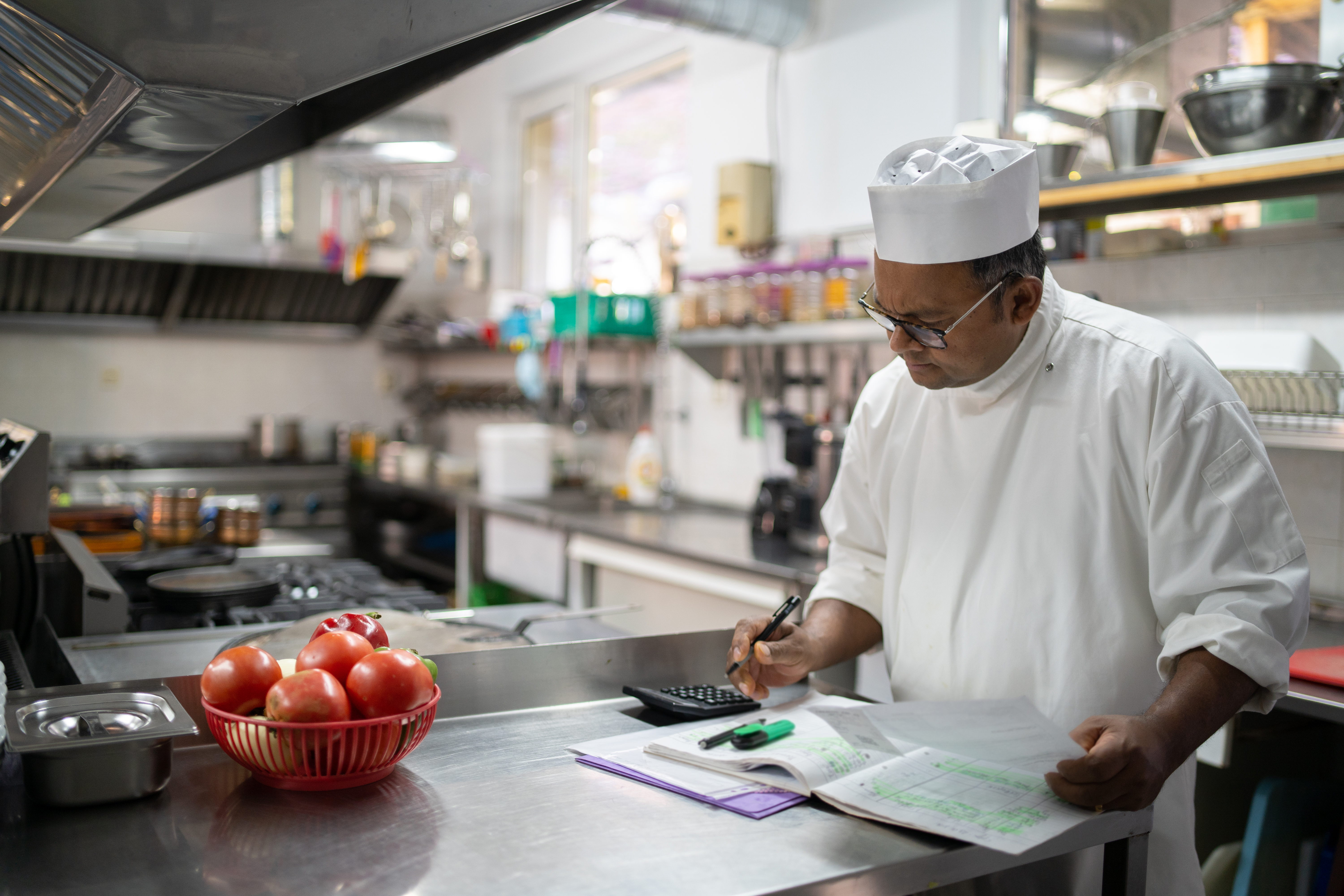 A chef works in a kitchen