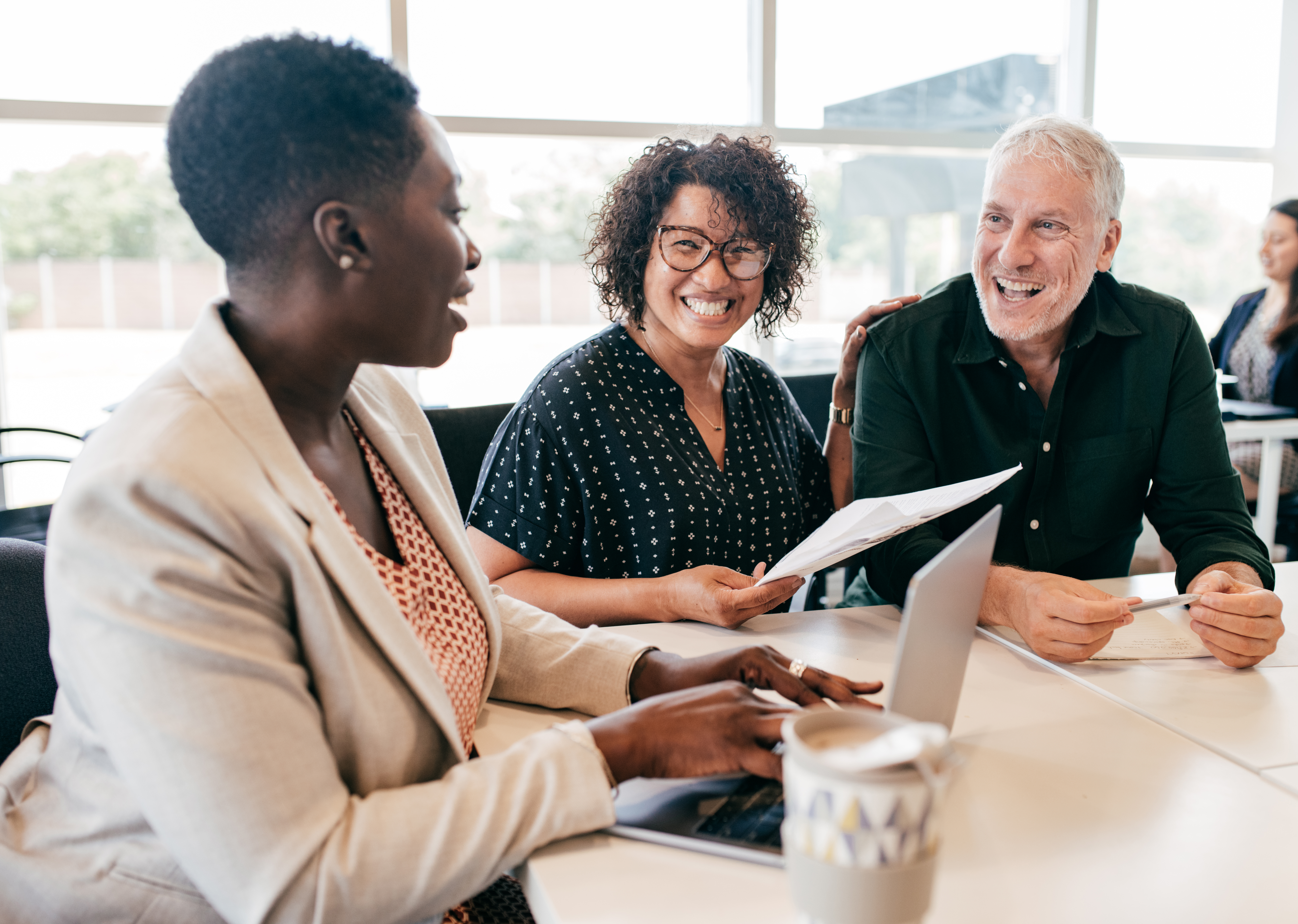 Financial advisor meeting with two clients