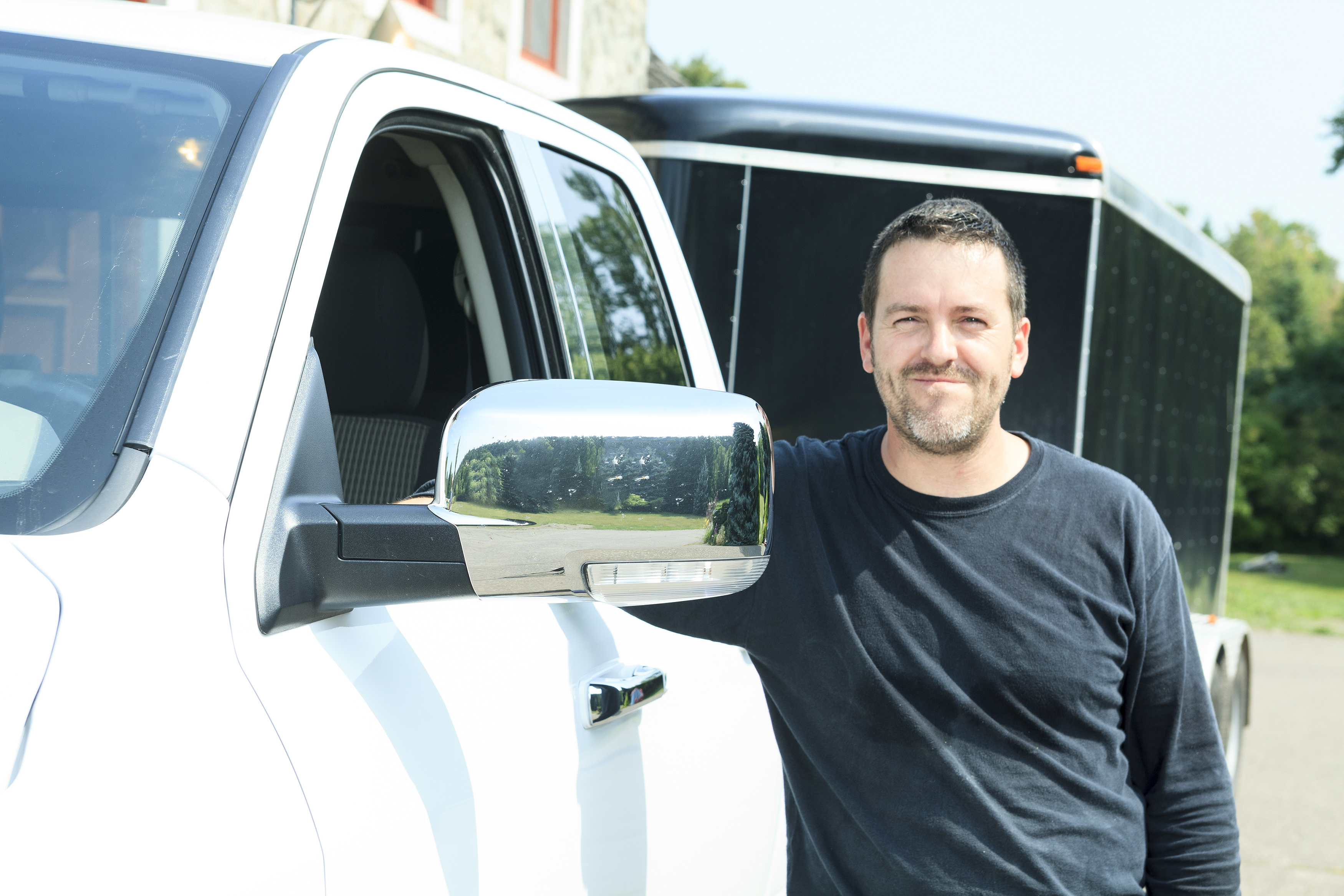 Man with his truck and trailer